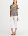 This airy knit with a hint of shimmer, thanks to metallic thread, also features a feminine neckline and beloved fit.V-neckShort sleevesPull-on styleAbout 24 from shoulder to hem83% linen/16% metallic thread/1% cottonHand washImported of Italian fabric Model shown is 5'10 (177cm) wearing US size Small. 