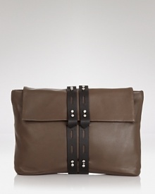 Luxurious and deceptively spacious, ALLIBELLE's over sized clutch is elevated in rich leather with a haute, handheld shape. Luxurious and deceptively spacious, ALLIBELLE's over sized clutch is elevated in rich leather with a haute, handheld shape.