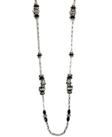 Define your style. This bold, beaded necklace by Nine West highlights plastic jet and clear bead stations strung from a silver tone mixed metal chain. Approximate length: 48 inches. Define your style. This bold, beaded necklace by Nine West highlights plastic jet and clear bead stations strung from a silver tone mixed metal chain. Approximate length: 48 inches.