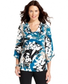 Alfani's top features stylish design touches like a cowl neckline, floral print and asymmetrical sleeves.