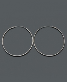 A wardrobe staple that outlives seasons, trends and time. Crafted in sterling silver, endless hoop earrings by Unwritten hook invisibly. Approximate diameter: 2-1/4 inches. A wardrobe staple that outlives seasons, trends and time. Crafted in sterling silver, endless hoop earrings by Unwritten hook invisibly. Approximate diameter: 2-1/4 inches.