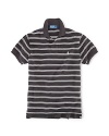 Tailored in a relaxed, comfortable fit that's cut wider through the body, this short-sleeved polo shirt is rendered in breathable cotton mesh with sleek stripes for casual polish