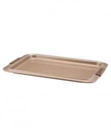 A cookie sheet that knows when to let go, this piece of bakeware is an essential for hassle-free cooking with a strong carbon steel core coated in a durable bronze nonstick finish that provides quick and effortless food release and fast cleaning. Designed with wide rimming along the edge, this cookie sheet is easy to maneuver and handle even with bulky oven mitts. Limited lifetime warranty. A cookie sheet that knows when to let go, this piece of bakeware is an essential for hassle-free cooking with a strong carbon steel core coated in a durable bronze nonstick finish that provides quick and effortless food release and fast cleaning. Designed with wide rimming along the edge, this cookie sheet is easy to maneuver and handle even with bulky oven mitts. Limited lifetime warranty.