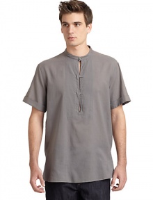 THE LOOKBanded collarFront button placket with keyhole detailsShort cuffed sleeves Seam detailsSide ventsTHE MATERIALCottonCARE & ORIGINMachine washMade in Italy THE LOOKBanded collarFront button placket with keyhole detailsShort cuffed sleeves Seam detailsSide ventsTHE MATERIALCottonCARE & ORIGINMachine washMade in Italy