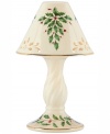 With bands of gold, pierced detail and a holly motif to match the beloved Holiday dinnerware pattern, this porcelain candle lamp from Lenox creates instant Christmas ambiance.