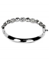 Dramatic and dazzling. Adorned with glittering pave glass accents, Givenchy's bangle bracelet will add glitz and glamour to your look for day or evening. Crafted in silver tone mixed metal. Approximate diameter: 2-3/8 inches x 2 inches.