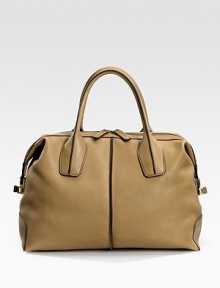Rich leather design with contrast stitching has two top handles and an adjustable messenger strap. Double top handles, 6 drop Adjustable messenger strap, 14 drop Zipper closure Metal feet Inside pockets Cotton canvas lining 16W X 10H X 7D Made in Italy Rich leather design with contrast stitching has two top handles and an adjustable messenger strap. Double top handles, 6 drop Adjustable messenger strap, 14 drop Zipper closure Metal feet Inside pockets Cotton canvas lining 16W X 10H X 7D Made in Italy