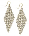 You've never looked so glam! Dozens of round-cut crystals in a pretty diamond pattern adorn Alfani's gorgeous drop earrings. Set in gold tone mixed metal. Approximate drop: 3 inches.