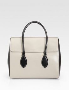 Sumptuously sleek leather in a shaped flap silhouette, crafted in a two-tone palette for a dynamic look.Double top handles, 4½ dropMagnetic snap flap closureProtective metal feetOne inside zip pocketTwo inside open pocketsCotton lining14W X 12H X 4¼DMade in Italy Sumptuously sleek leather in a shaped flap silhouette, crafted in a two-tone palette for a dynamic look.Double top handles, 4½ dropMagnetic snap flap closureProtective metal feetOne inside zip pocketTwo inside open pocketsCotton lining14W X 12H X 4¼DMade in Italy