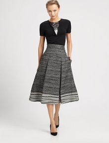 Textural two-tone yarn melange, in a crisply pleated tea-length silhouette.Banded waistPleatsConcealed back zipSilk liningAbout 30 long69% wool/31% polyamideDry cleanMade in ItalyModel shown is 5'10½ (177cm) wearing US size 4. Textural two-tone yarn melange, in a crisply pleated tea-length silhouette.Banded waistPleatsConcealed back zipSilk liningAbout 30 long69% wool/31% polyamideDry cleanMade in ItalyModel shown is 5'10½ (177cm) wearing US size 4.