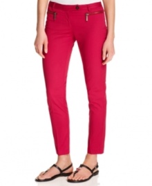 MICHAEL Michael Kors gives you the skinny on style with these sleek, slim-fitting petite pants, made extra modern with zippered front pockets.