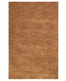 Varying shades of tan create a lush texture that's sure to make waves in your home. Crafted by hand-tufting fibers of soft, rich wool, this area rug from St. Croix is rustic and refined, boasting a tonal flow that adds subtle dimension to your decor. Varying shades of tan create a lush texture that's sure to make waves in your home. Crafted by hand-tufting fibers of soft, rich wool, this area rug from St. Croix is rustic and refined, boasting a tonal flow that adds subtle dimension to your decor.