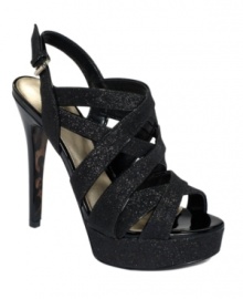 Everything is better with glitter. The eye-catching Kio platform sandals by GUESS take a sexy, strappy silhouette and make it even better with light-reflecting accents.