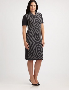 An undeniable head turner, this jersey dress features a zebra-print front. A touch of stretch ensures that you will love the way it fits you.Feminine necklineShort sleevesPrinted frontPull-on stylePrincess seams on backAbout 24 from natural waist95% wool/3% polyester/2% Lycra®Dry cleanMade in Italy