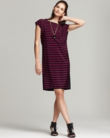 A side-button placket puts a preppy spin DKNY's striped dress. A side-button placket puts a preppy spin DKNY's striped dress.