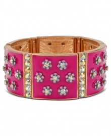 Flower power. Betsey Johnson's slip-on stretch bracelet features a pink design decorated with flowers and crystal accents. Set in antiqued gold tone mixed metal. Approximate length: 7-1/2 inches. Approximate width: 1 inch.