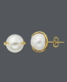 Studs with simple flair. These polished cultured freshwater pearl (2 x 10 mm) earrings feature a unique claw-style setting crafted in 14k gold. Approximate diameter: 1/2 inch. Studs with simple flair. These polished cultured freshwater pearl (2 x 10 mm) earrings feature a unique claw-style setting crafted in 14k gold. Approximate diameter: 1/2 inch.