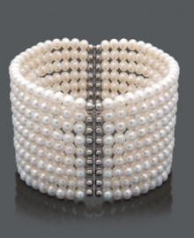 Layer your wrist in nine, elegant rows of pearl. This bracelet features cultured freshwater pearls (4-5 mm) in a chic cuff design. Crafted in sterling silver. Bracelet stretches to fit wrist. Approximate length: 7 inches.