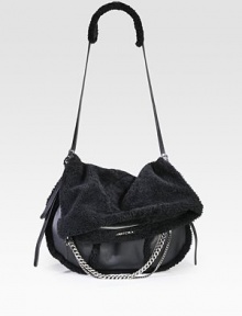 An edgy style in soft shearling accented with leather trim and shiny chain link accents.Adjustable leather and shearling shoulder strap, 12-21½ dropFlap closureOne zip pocket on flapOne inside zip pocket17W X 9H X 4DMade in Italy An edgy style in soft shearling accented with leather trim and shiny chain link accents.Adjustable leather and shearling shoulder strap, 12-21½ dropFlap closureOne zip pocket on flapOne inside zip pocket17W X 9H X 4DMade in Italy