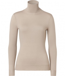 Luxe basics anchor any modern wardrobe, and Ralph Laurens sand-hued merino wool pullover proves an elegant indispensable - Fitted, feminine cut tapers through waist - Long sleeves and turtleneck collar - Finely ribbed trim at cuffs and hem - Versatile and polished, seamlessly goes from work to weekend - Pair with everything from pencil skirts and suit trousers to skinny denim and leather pants