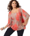 Batwing sleeves add dramatic flair to INC's printed plus size top-- pair it with your favorite jeans.