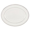 Delicate vines unfurl on soft pewter in the aptly named Sheer Grace oval platter from Lenox. Lustrous white porcelain and bands of sparkling platinum ground the look in understated splendor. Qualifies for Rebate
