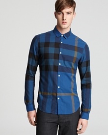 An extra-large check pattern offers a striking and unique designer look on this casual button-down that's playful and handsome. An extra-large check pattern offers a striking and unique designer look on this casual button-down that's playful and handsome.