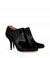 Finish your look on a luxe note with Givenchys jet black haircalf booties, polished with an ultra modern metal heel insert for that added edge of streamlined sensuality - Softly pointed toe, back zip, covered leather heel - Wear for cocktails with opaque tights and micro-minis