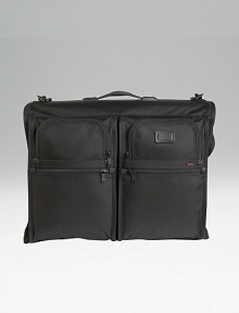 Tumi's original garment bag design, still sought after by business travelers. Universal hanger bracket for any hanger type Specially shaped pockets for shoes, accessories, belts and hair dryers Top carry handle and removable shoulder strap Add-a-bag sleeve lets it ride on wheeled cases Tumi Tracer Protection Ballistic nylon Imported 18H X 23½W X 5½D Tumi's original garment bag design, still sought after by business travelers. Universal hanger bracket for any hanger type Specially shaped pockets for shoes, accessories, belts and hair dryers Top carry handle and removable shoulder strap Add-a-bag sleeve lets it ride on wheeled cases Tumi Tracer Protection Ballistic nylon Imported 18H X 23½W X 5½D