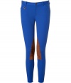 Take on Ralph Laurens iconic preppy look in these bright blue stretch twill jodhpur-style trousers - Slash side pockets, zip fly, button closure, belt loops, brown suede patches horseshoe charm on belt loop, snapped cuffs - Form-fitting, ankle length - Wear with a button-down, blazer and flats