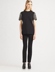 This scuba-inspired techno fabric top is embellished with sparkling beaded sleeves.CrewneckBeaded short sleevesConcealed back zipSilk lining94% polyamide/6% elastaneDry cleanMade in ItalyModel shown is 5'10 (177cm) wearing US size 4. This scuba-inspired techno fabric top is embellished with sparkling beaded sleeves.CrewneckBeaded short sleevesConcealed back zipSilk lining94% polyamide/6% elastaneDry cleanMade in ItalyModel shown is 5'10 (177cm) wearing US size 4.