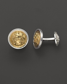 Swirling 18K gold oak leaves, framed in gleaming sterling silver. By Buccellati.