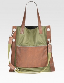This charming carryall of sturdy resilient nylon and leather will protect and tote all of your essentials in style with an exterior zip pocket, three interior tech compartments and a detachable shoulder strap for maximum versatility.Double top handlesAdjustable shoulder strapExterior, interior zip pockets90% nylon/10% leather18W x 18H x 1DImported This charming carryall of sturdy resilient nylon and leather will protect and tote all of your essentials in style with an exterior zip pocket, three interior tech compartments and a detachable shoulder strap for maximum versatility.Double top handlesAdjustable shoulder strapExterior, interior zip pockets90% nylon/10% leather18W x 18H x 1DImported