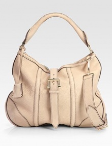 Soft pebble-grain leather in a slouchy silhouette, cinched by a wide front buckle with dual straps for versatility.Top handle, 8 dropAdjustable removable strap, 19-21 drop Buckle flap snap over top zip closureOne inside zip pocketThree inside open pocketsNylon lining17W X 12½H X 1½DMade in Italy