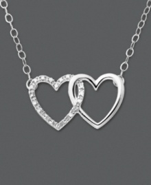 Tell her how she's captured your heart. This heart necklace features two interlocking hearts set in 14k white gold. One heart has been dusted in round-cut diamond accents. Approximate length: 16 inches. Approximate drop: 3/8 inch. Tell her how she's captured your heart. This heart necklace features two interlocking hearts set in 14k white gold. One heart has been dusted in round-cut diamond accents. Approximate length: 16 inches. Approximate drop: 3/8 inch.