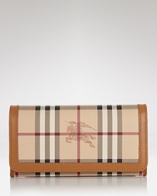 Burberry polishes off practical style with this billfold wallet. Crafted from durable cotton and ideally sized to tuck inside a purse, it's sure to keep your essentials in check. Burberry polishes off practical style with this billfold wallet. Crafted from durable cotton and ideally sized to tuck inside a purse, it's sure to keep your essentials in check.