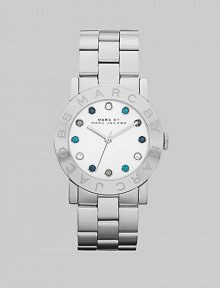 A sleek stainless steel style with multicolored stone markers for a pop of color. Quartz movementWater resistant to 5 ATMRound stainless steel case, 36mm (1.4)Logo etched bezelSilver dialMulticolored glass stone hour markersSecond hand Stainless steel link braceletImported