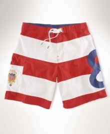 A sporty swim trunk with bold stripes and athletic-inspired embroidery is crafted in a quick-drying cotton-nylon blend for an attractive option on the beach. A sporty swim trunk with bold stripes and athletic-inspired embroidery is crafted in a quick-drying cotton-nylon blend for an attractive option on the beach.