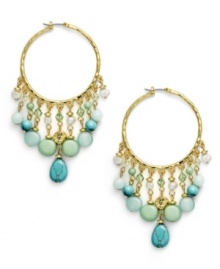 Think spring. The pastel combination of reconstituted turquoise, freshwater pearls (4 mm), and jade-colored beads exude serenity on the Green Valley hoop earrings from Lauren by Ralph Lauren. Setting and click-it clasp crafted in gold tone mixed metal. Approximate drop: 3 inches. Approximate diameter: 1-1/4 inches.