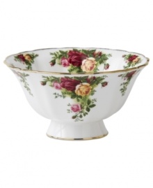 Garnished with the popular Old Country Roses dinnerware pattern, this footed Royal Albert bowl brings the bounty of the English countryside to your table in fine bone china with gold, scalloped edges. Garnished with the popular Old Country Roses dinnerware pattern, this footed Royal Albert bowl brings the bounty of the English countryside to your table in fine bone china with gold, scalloped edges.