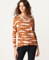 An asymmetrical hi-lo hem adds edge to this Kensie abstract-printed top for a casual yet cool look!