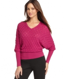 An allover waffle knit adds on-trend texture to this silk-blend Calvin Klein sweater -- perfect for cold-weather style! An allover waffle knit adds on-trend texture to this silk-blend Calvin Klein sweater -- perfect for cold-weather style!