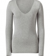 Stylish long sleeved shirt in fine stretch viscose - Very soft, comfortable quality - In classic light grey - With a wide, feminine V-neckline - The cut is slim, fitted and slightly longer, no cuffs - A casual, yet dressed up alternative to a blouse - Pairs with a pant suit, jeans or a cardigan