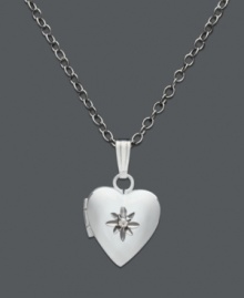 A timeless keepsake in silver. This children's heart locket features a central diamond accent. Set in sterling silver. Approximate length: 13 inches. Approximate drop: 1/2 inch. A timeless keepsake in silver. This children's heart locket features a central diamond accent. Set in sterling silver. Approximate length: 13 inches. Approximate drop: 1/2 inch.