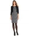 A tweed-like texture at the center bodice and skirt and a pop of faux leather trim at the waist make this Calvin Klein dress an intriguing addition to your weekday wardrobe.