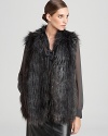 Take a walk on the wild side in a plush DKNY faux-fur vest. Slip it over everyday looks for instant exotic chic.