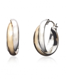 Snap up the hot, new trend of two tone jewelry with Monet's versatile twist hoops. Earrings feature an overlapping hoop design crafted in silver tone and gold tone mixed metal. Approximate diameter: 1 inch. Snap up the hot, new trend of two tone jewelry with Monet's versatile twist hoops. Earrings feature an overlapping hoop design crafted in silver tone and gold tone mixed metal. Approximate diameter: 1 inch.
