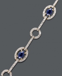 Look your absolute best in this stunning accessory. Victoria Townsend's regal-looking bracelet highlights oval-cut sapphires (2 ct. t.w.) and diamond-accented circular and oval links. Crafted in 18k gold over sterling silver. Approximate length: 7 inches. Look your absolute best in this stunning accessory. Victoria Townsend's regal-looking bracelet highlights oval-cut sapphires (2 ct. t.w.) and diamond-accented circular and oval links. Crafted in 18k gold over sterling silver. Approximate length: 7 inches.