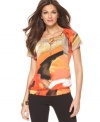 A bright painterly print adds a bold splash of color to this Alfani top -- perfect over denim or trousers!