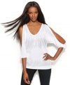 Studs and bare shoulders add to the appeal of INC's sexy, slouchy top!